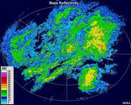 Radar reflectivity showing areas of light, moderate and heavy precipitation.  Light precipitation is shown in blue colors, moderate precipitation ranges from dark green into yellow, and heavy precipitation is shown in red and pink shades.