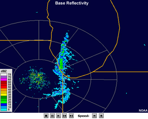 Radar reflectivity loop showing moderate intensity cells aligned in a large band that runs north to south along roughly the center of lake Michigan. 