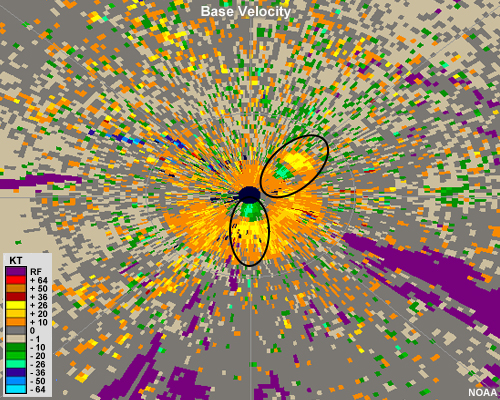 Radial velocity image showing pronounced divergent couplets just to the south and just to the northeast of the radar.