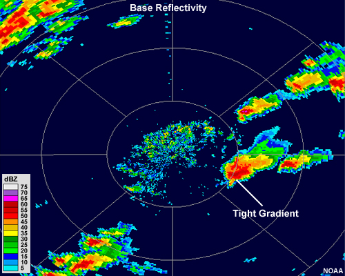 Radar reflectivity image showing a large, intense circular thunderstorm with a small hook echo on its southern flank
