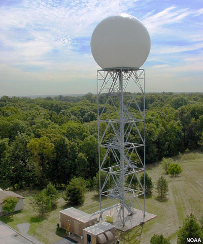 Photograph of an NWS Doppler radar tower as viewed from approximately the same level aerially.